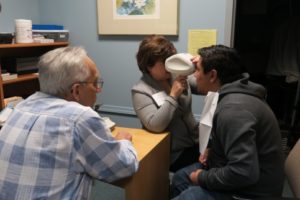 Staff member conducting vision screening